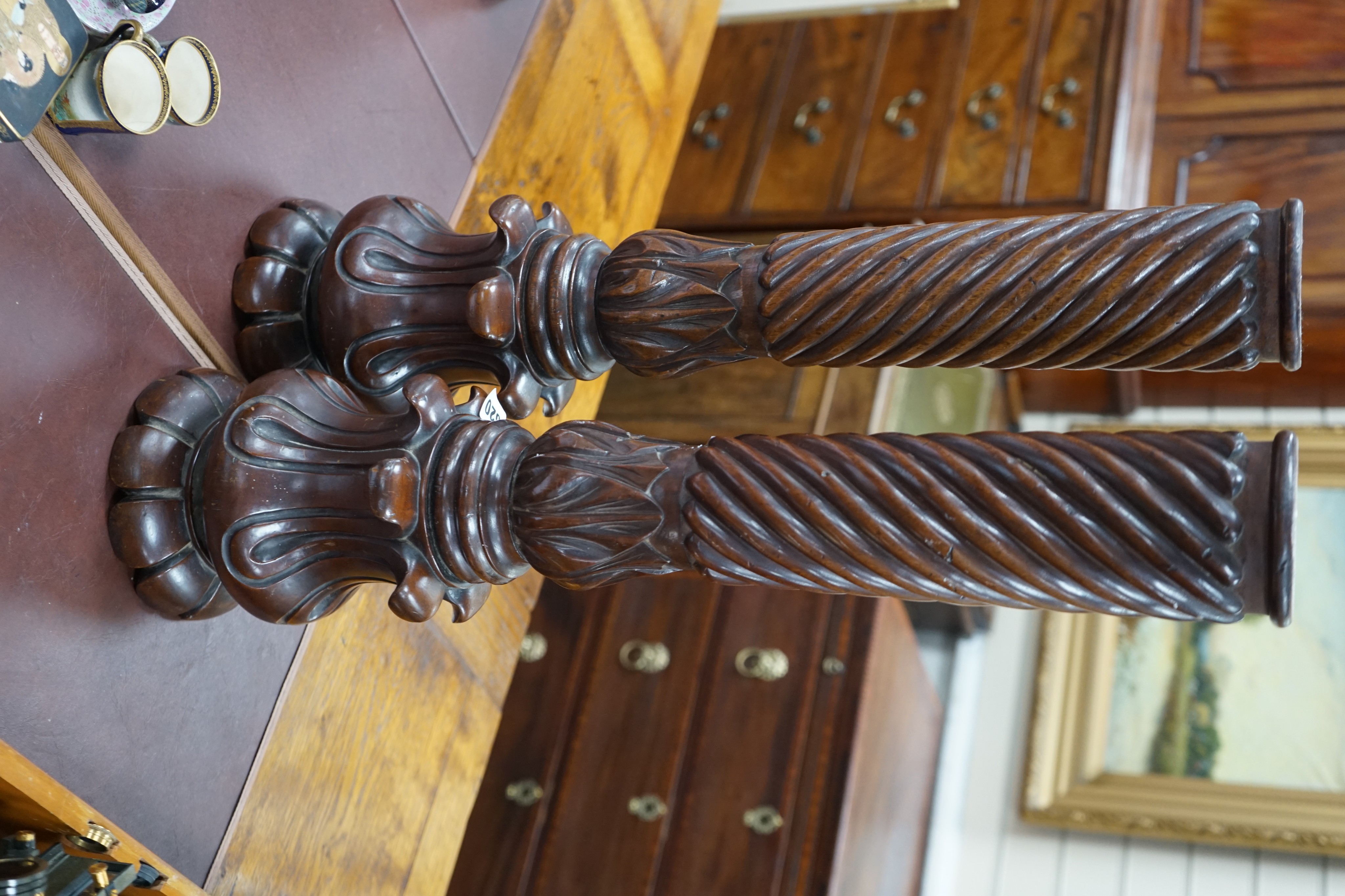 A pair of William mahogany 'bedpost' candlestands
